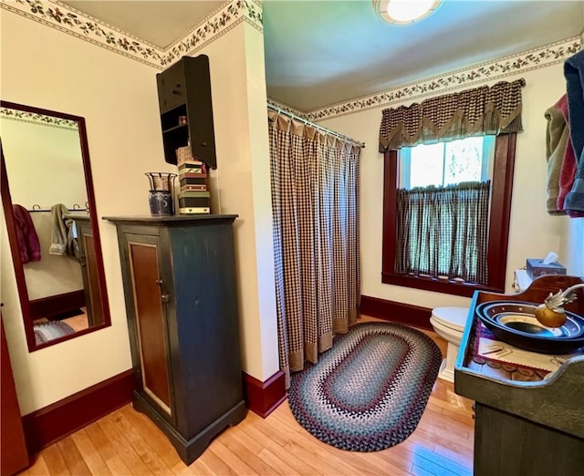 225 John Cook Rd, Unadilla, NY 13849 - full bathroom with hardwood / wood-style floors, baseboards, toilet, and curtained shower