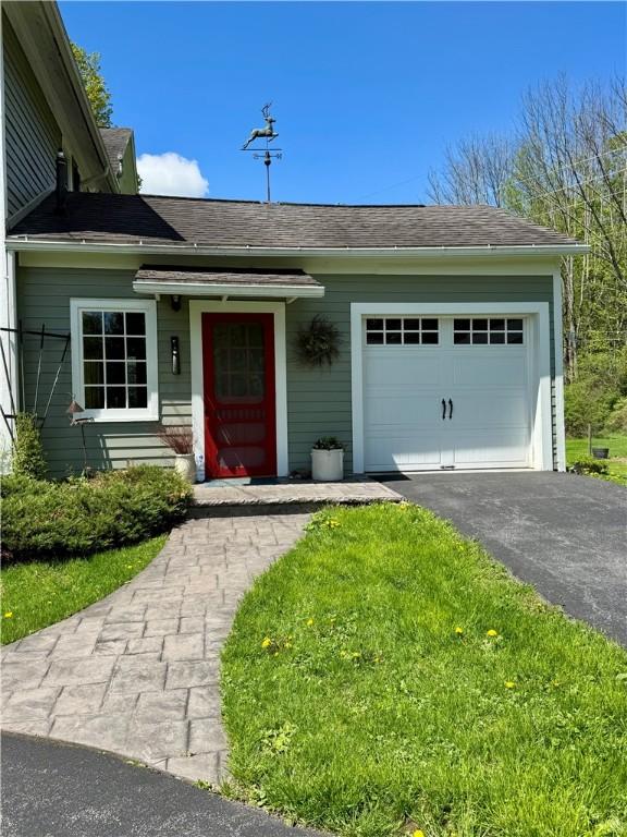 225 John Cook Rd, Unadilla, NY 13849 - ranch-style home featuring a garage and driveway