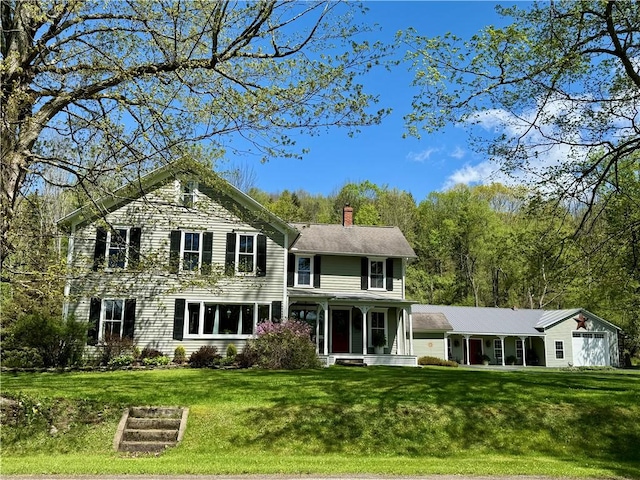 225 John Cook Rd, Unadilla, NY 13849 - view of front of property featuring a chimney, a front lawn, and covered porch