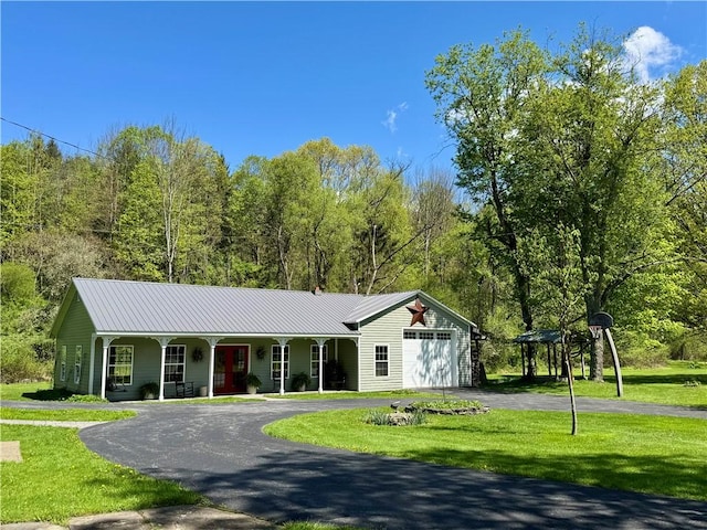 225 John Cook Rd, Unadilla, NY 13849 - ranch-style home with a porch, a front yard, a garage, asphalt driveway, and metal roof