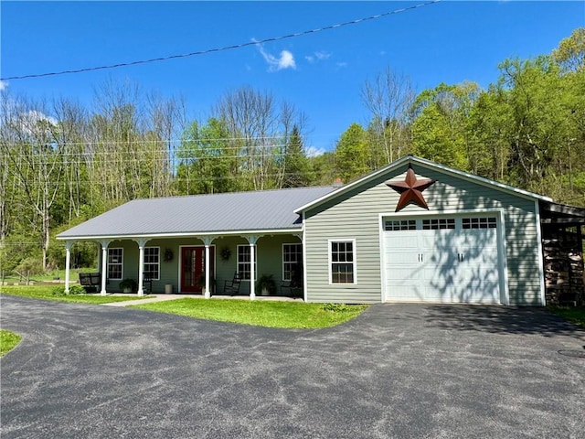 225 John Cook Rd, Unadilla, NY 13849 - ranch-style home featuring driveway, a porch, and metal roof