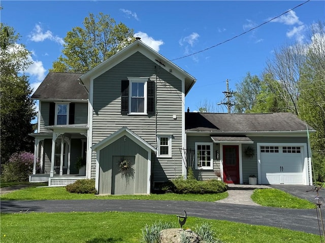 225 John Cook Rd, Unadilla, NY 13849 - traditional-style house with a garage, driveway, a front yard, and a porch