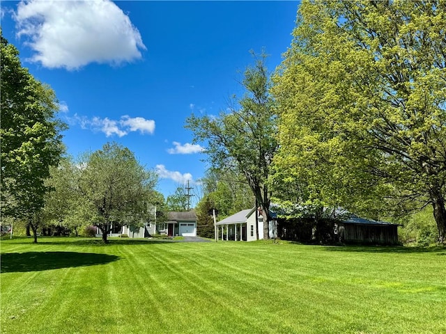 225 John Cook Rd, Unadilla, NY 13849 - view of grassy yard with a garage
