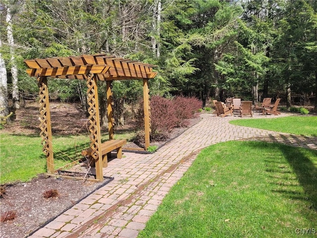 177 Woodchuck Run, Jefferson, NY 12093 - view of grassy yard featuring a patio area, a pergola, and a fire pit