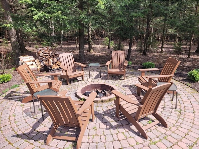 177 Woodchuck Run, Jefferson, NY 12093 - view of patio featuring an outdoor fire pit