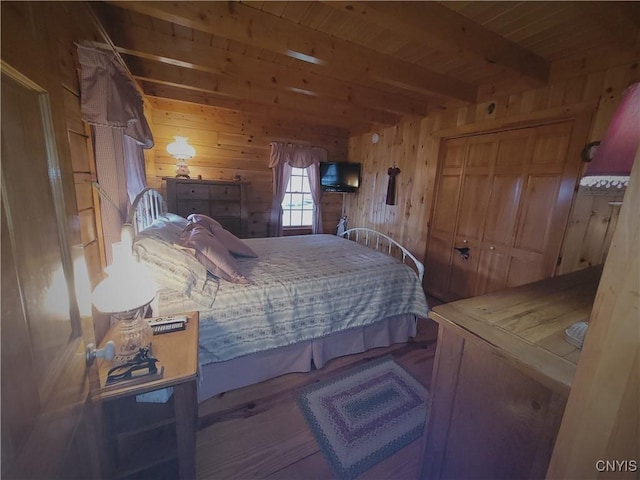 177 Woodchuck Run, Jefferson, NY 12093 - bedroom featuring wooden ceiling, beamed ceiling, wooden walls, and wood finished floors