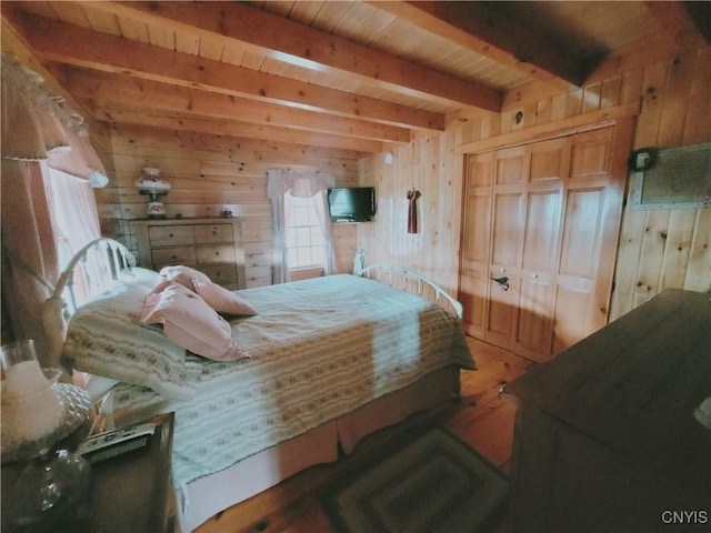 177 Woodchuck Run, Jefferson, NY 12093 - bedroom featuring beamed ceiling, wood walls, wood finished floors, and wooden ceiling