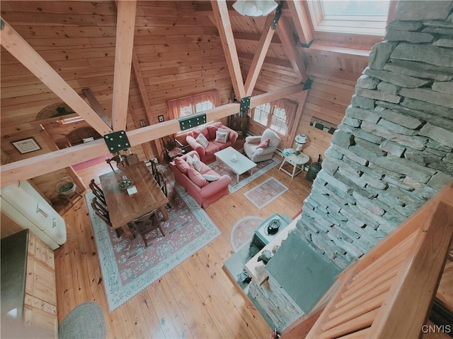 177 Woodchuck Run, Jefferson, NY 12093 - living area with wood walls, wooden ceiling, and wood-type flooring
