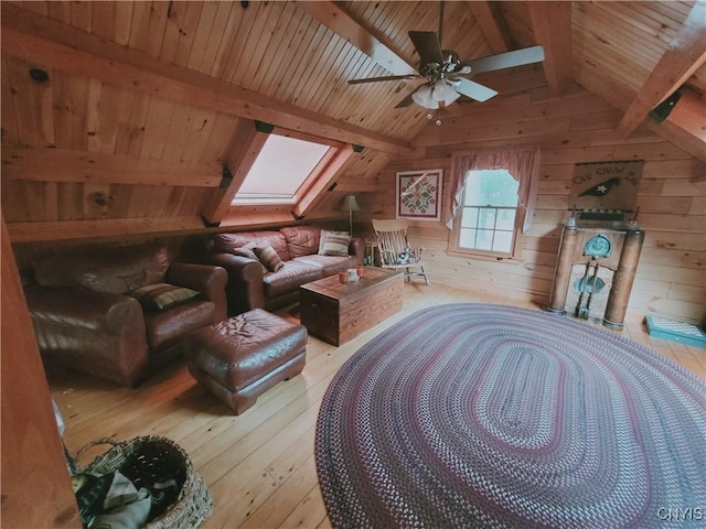 177 Woodchuck Run, Jefferson, NY 12093 - living area featuring a skylight, wood walls, light wood finished floors, wooden ceiling, and ceiling fan