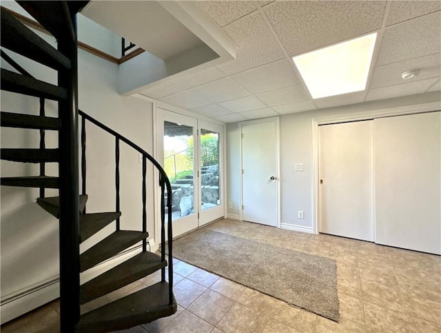 5 Orchard Dr, Corning, NY 14830 - carpeted entryway featuring stairway, tile patterned floors, a paneled ceiling, baseboards, and baseboard heating