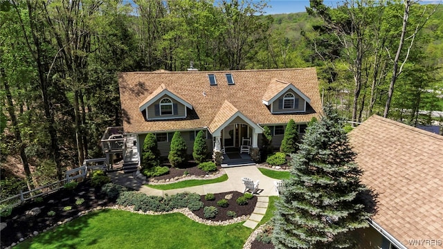 233 Falls Rd, Aurora, NY 14170 - view of front of property featuring roof with shingles and a front lawn