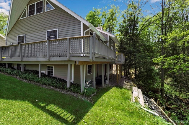233 Falls Rd, Aurora, NY 14170 - rear view of house featuring a lawn and a wooden deck