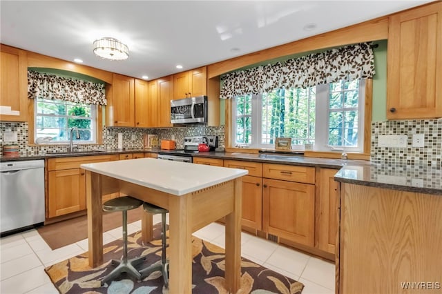 233 Falls Rd, Aurora, NY 14170 - kitchen featuring appliances with stainless steel finishes, a sink, backsplash, light tile patterned flooring, and recessed lighting