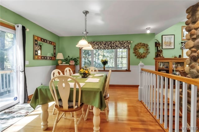 233 Falls Rd, Aurora, NY 14170 - dining room with wainscoting and light wood-style flooring