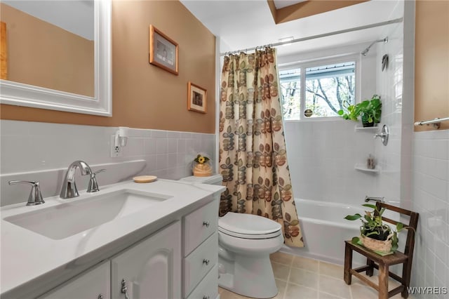 233 Falls Rd, Aurora, NY 14170 - bathroom featuring tile walls, toilet, shower / tub combo, vanity, and tile patterned flooring