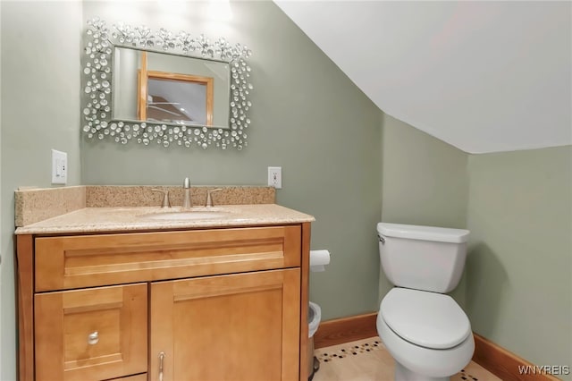233 Falls Rd, Aurora, NY 14170 - half bath featuring vanity, toilet, and vaulted ceiling