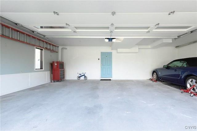 4675 Limeledge Rd, Marcellus, NY 13108 - garage with a garage door opener