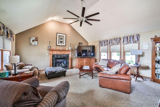 living room with a ceiling fan, carpet floors, lofted ceiling, a fireplace, and baseboards