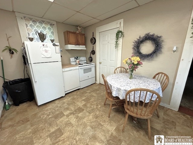 154 N Portage St, Westfield, NY 14787 - kitchen with white appliances, under cabinet range hood, a drop ceiling, and light countertops