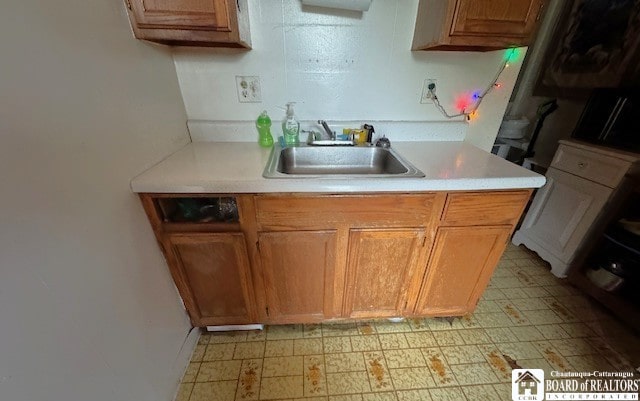 154 N Portage St, Westfield, NY 14787 - kitchen featuring light flooring, a sink, and light countertops