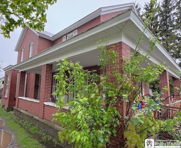 154 N Portage St, Westfield, NY 14787 - view of side of property featuring brick siding