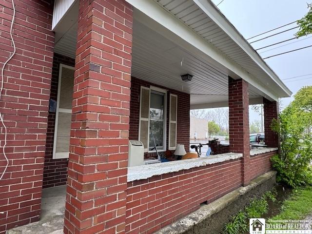154 N Portage St, Westfield, NY 14787 - view of side of home with brick siding and a porch