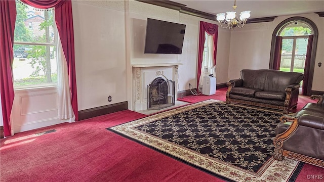 24 Grover St, Auburn, NY 13021 - living room with carpet flooring, a fireplace with flush hearth, a chandelier, and baseboards