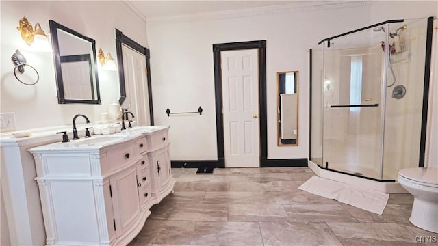 24 Grover St, Auburn, NY 13021 - full bathroom featuring double vanity, a stall shower, ornamental molding, toilet, and marble finish floors
