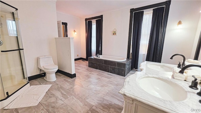 24 Grover St, Auburn, NY 13021 - full bathroom with a shower stall, a garden tub, double vanity, toilet, and baseboards