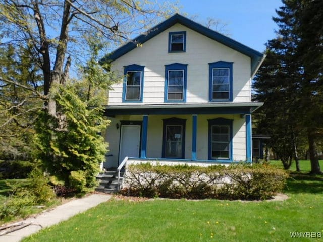 26 Robinson St, Hanover, NY 14136 - view of front of home with a porch and a front lawn