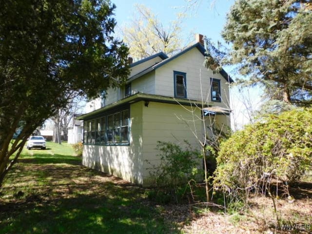 26 Robinson St, Hanover, NY 14136 - view of side of home with a chimney