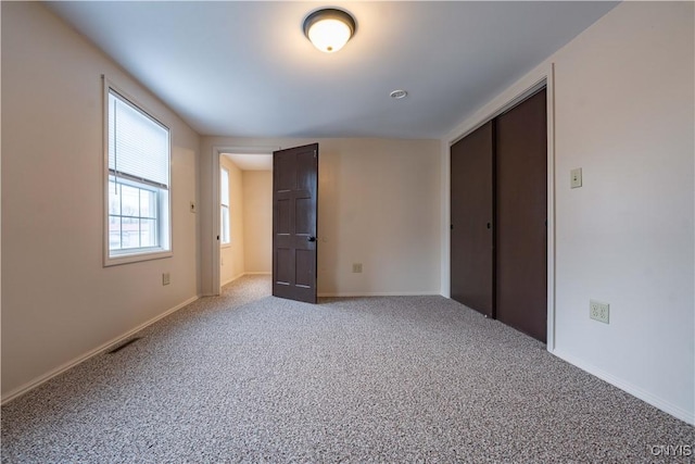 2795 State Route 12b, Marshall, NY 13328 - unfurnished bedroom with carpet, baseboards, and a closet