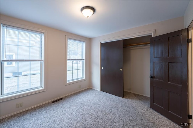 2795 State Route 12b, Marshall, NY 13328 - unfurnished bedroom with a closet, baseboards, and light colored carpet
