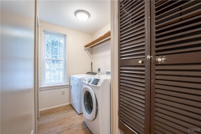 2795 State Route 12b, Marshall, NY 13328 - laundry room with washer and clothes dryer, light wood-style floors, and baseboards