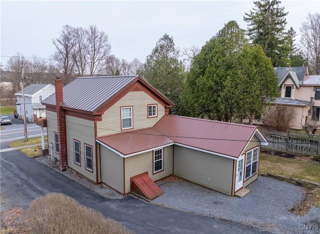 2795 State Route 12b, Marshall, NY 13328 - view of side of property with metal roof, a chimney, and fence