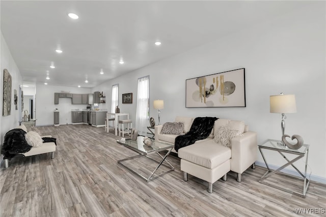 65 Kingsley St, Buffalo, NY 14208 - living room featuring light wood finished floors, recessed lighting, and baseboards