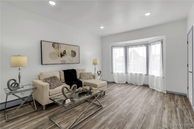 65 Kingsley St, Buffalo, NY 14208 - living area with wood finished floors, recessed lighting, baseboard heating, and baseboards