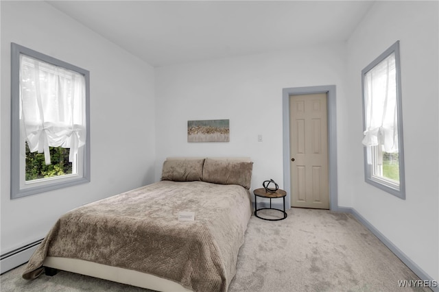 65 Kingsley St, Buffalo, NY 14208 - bedroom featuring multiple windows, carpet, baseboard heating, and baseboards