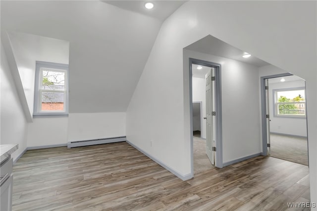 65 Kingsley St, Buffalo, NY 14208 - bonus room featuring a baseboard radiator, light wood-type flooring, vaulted ceiling, baseboards, and recessed lighting