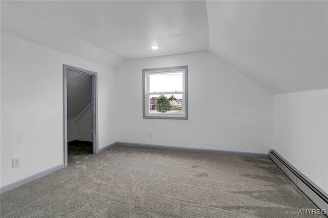 65 Kingsley St, Buffalo, NY 14208 - bonus room featuring a baseboard radiator, vaulted ceiling, carpet flooring, and baseboards