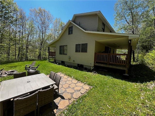 200 Torsten Ln, Davenport, NY 13750 - rear view of house featuring a lawn, a patio area, and outdoor dining area