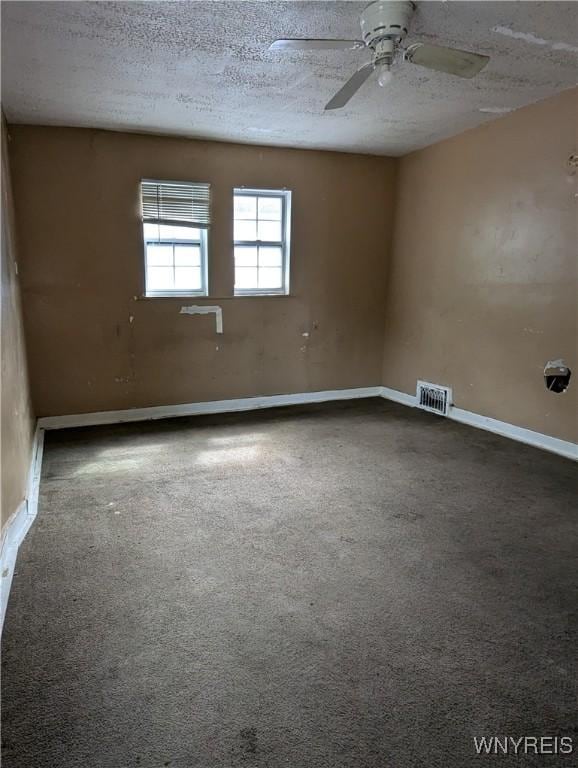 1706 Niagara St, Niagara Falls, NY 14303 - carpeted spare room with ceiling fan, a textured ceiling, and baseboards