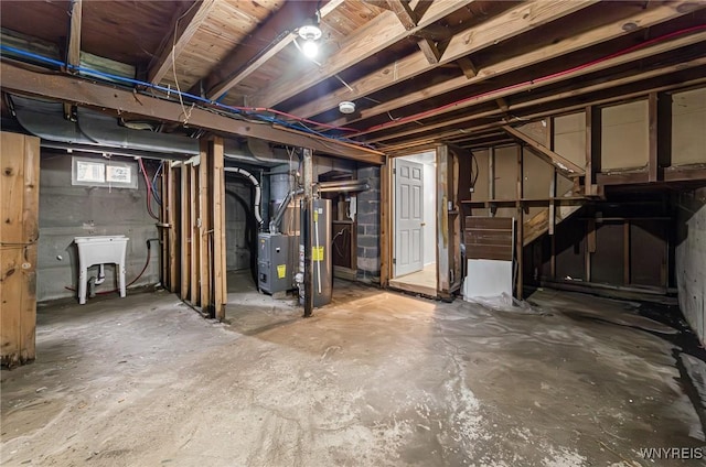414 18th St, Niagara Falls, NY 14303 - below grade area featuring heating unit, a sink, and water heater