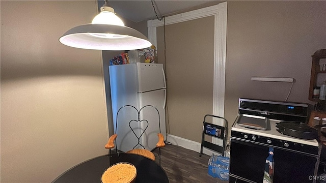 7 S 4th St, Fulton, NY 13069 - kitchen featuring black range with electric stovetop, freestanding refrigerator, wood finished floors, and baseboards