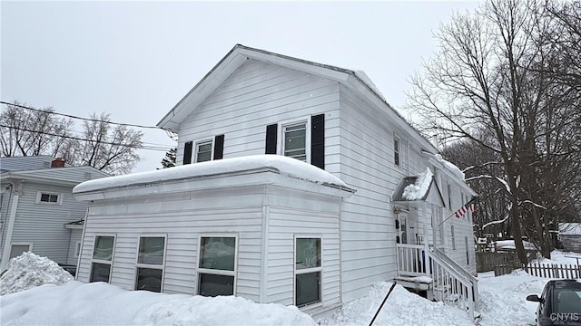 7 S 4th St, Fulton, NY 13069 - view of snowy exterior featuring fence