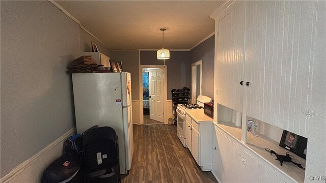 7 S 4th St, Fulton, NY 13069 - kitchen with white appliances, dark wood-type flooring, white cabinetry, crown molding, and light countertops