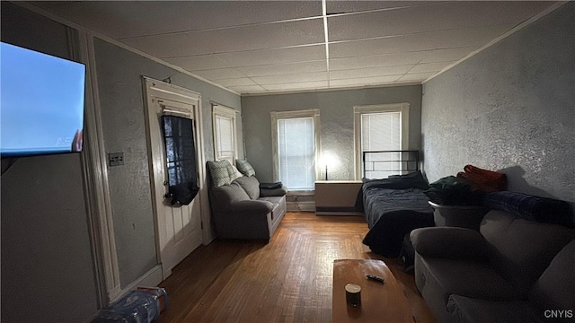 7 S 4th St, Fulton, NY 13069 - living area with a textured wall, ornamental molding, and wood finished floors