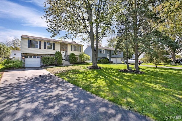 7025 Academy Ln, Lockport-Town, NY 14094 - bi-level home featuring asphalt driveway, an attached garage, a front lawn, and stone siding