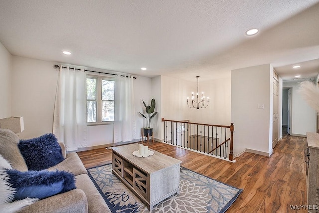 7025 Academy Ln, Lockport-Town, NY 14094 - living area featuring wood finished floors, recessed lighting, baseboards, and a chandelier