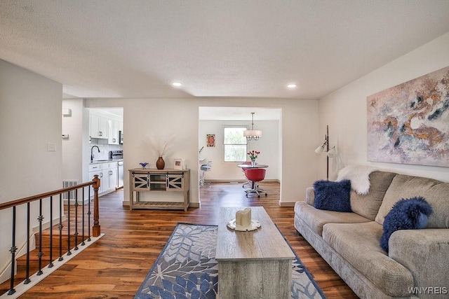 7025 Academy Ln, Lockport-Town, NY 14094 - living area featuring dark wood-type flooring, recessed lighting, baseboards, and a chandelier